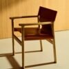 Jan chair made of light brown recycled leather fibres and FSC 100% solid ash wood with natural tone finish