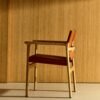 Jan chair made of light brown recycled leather fibres and FSC 100% solid ash wood with natural tone finish