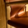 Jan chair made of light brown recycled leather fibres and FSC 100% solid ash wood with natural tone finish